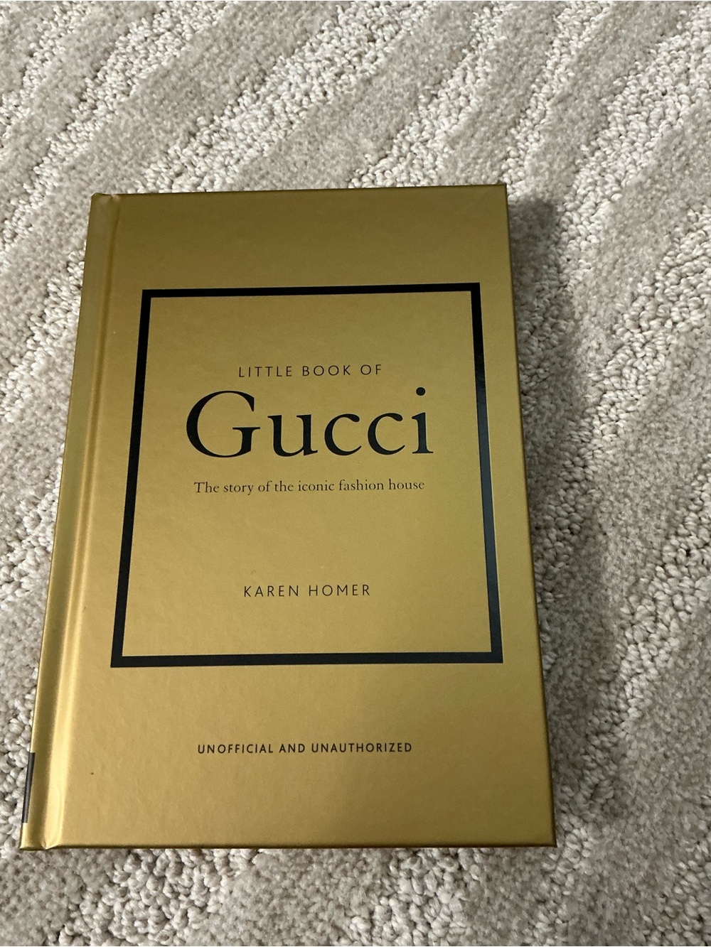 Gucci Gold Hardcover with Black Accents